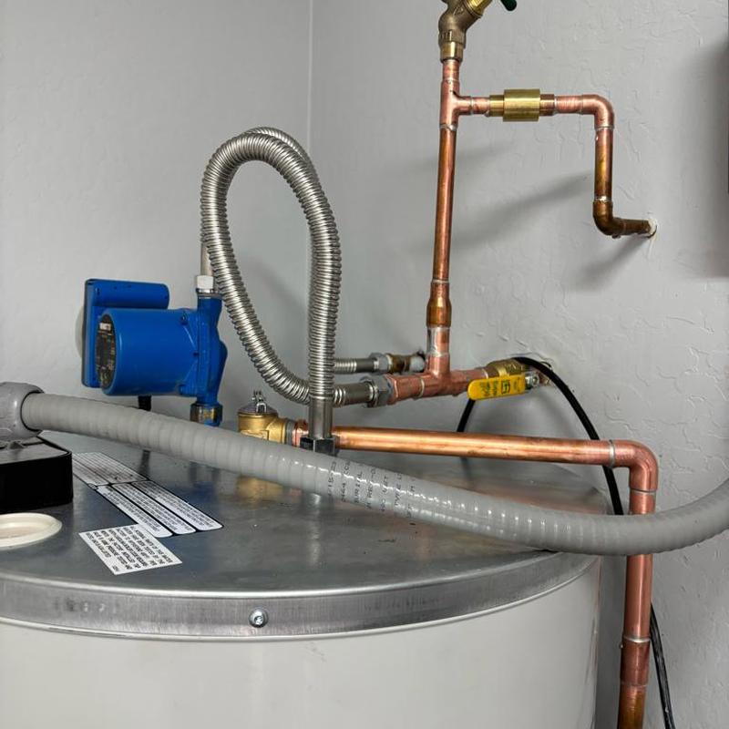 80-gallon water heater with new ball valve and flex lines