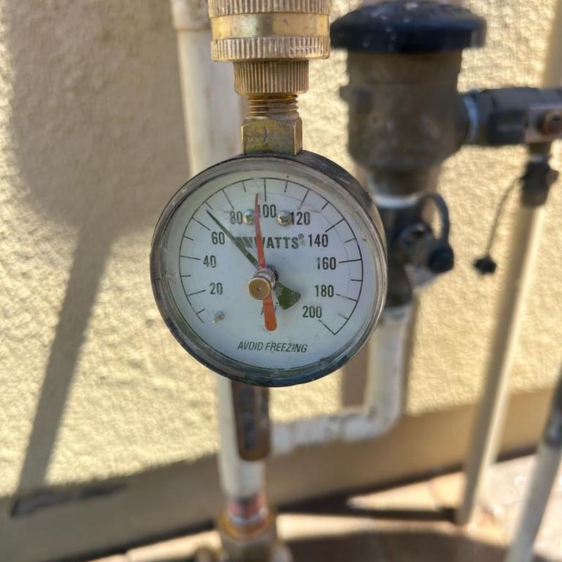 Pressure regulator valve pressure gauge showing PSI levels