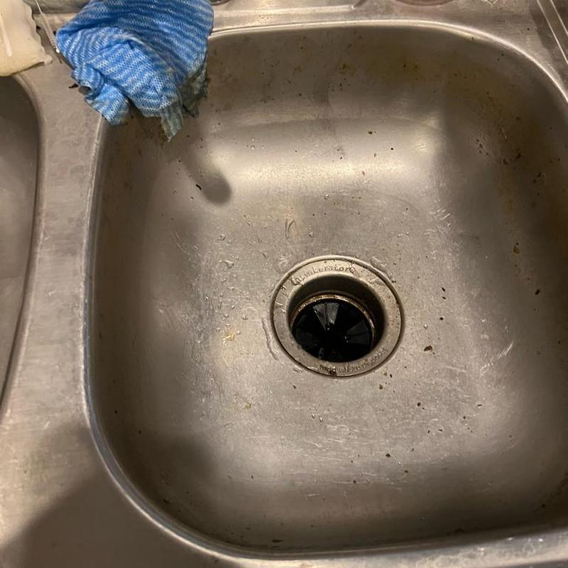 Garbage disposal reset with debris removed in sink