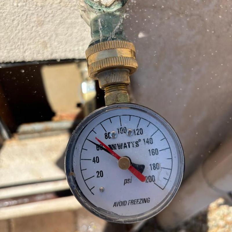 Pressure relief valve pressure gauge at 62 psi outdoors