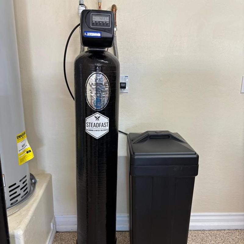 Whole home water softener system installed in garage