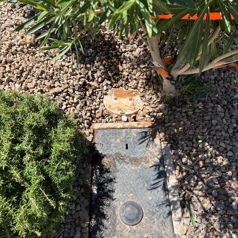 Pressure-reducing valve in landscaping cover box, Queen Creek