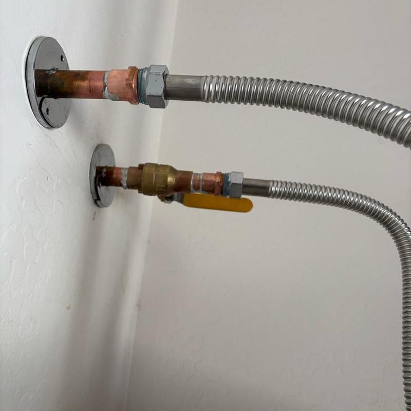 Water heater water supply valves with flex lines installed