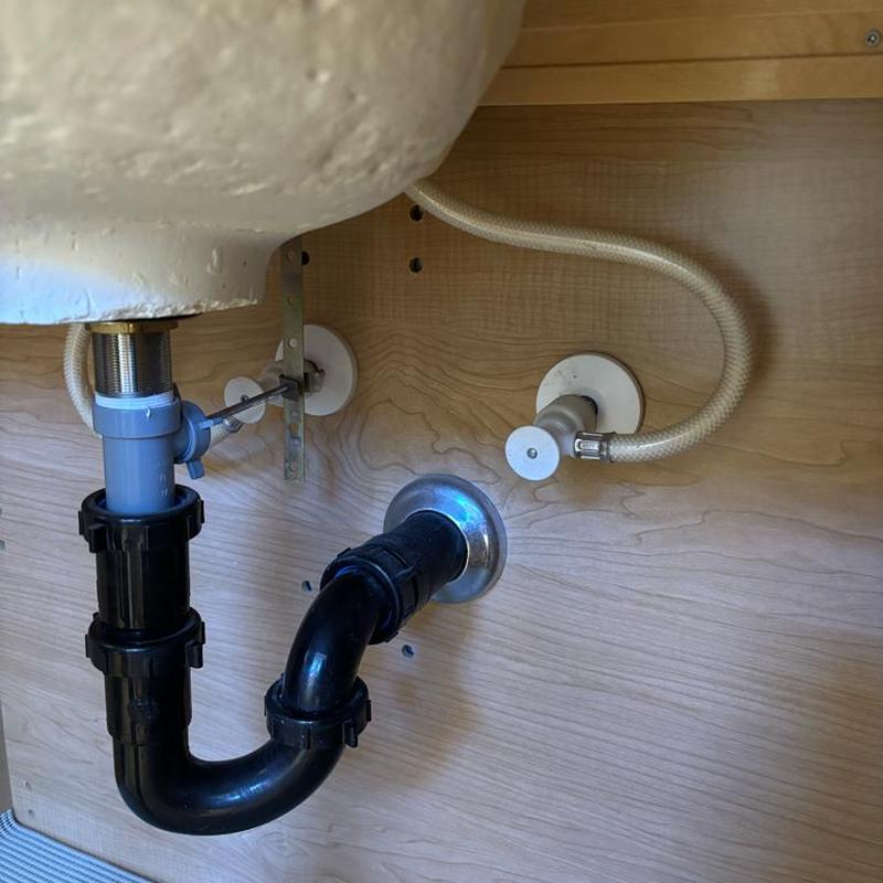 Angle stop valves and supply lines under sink