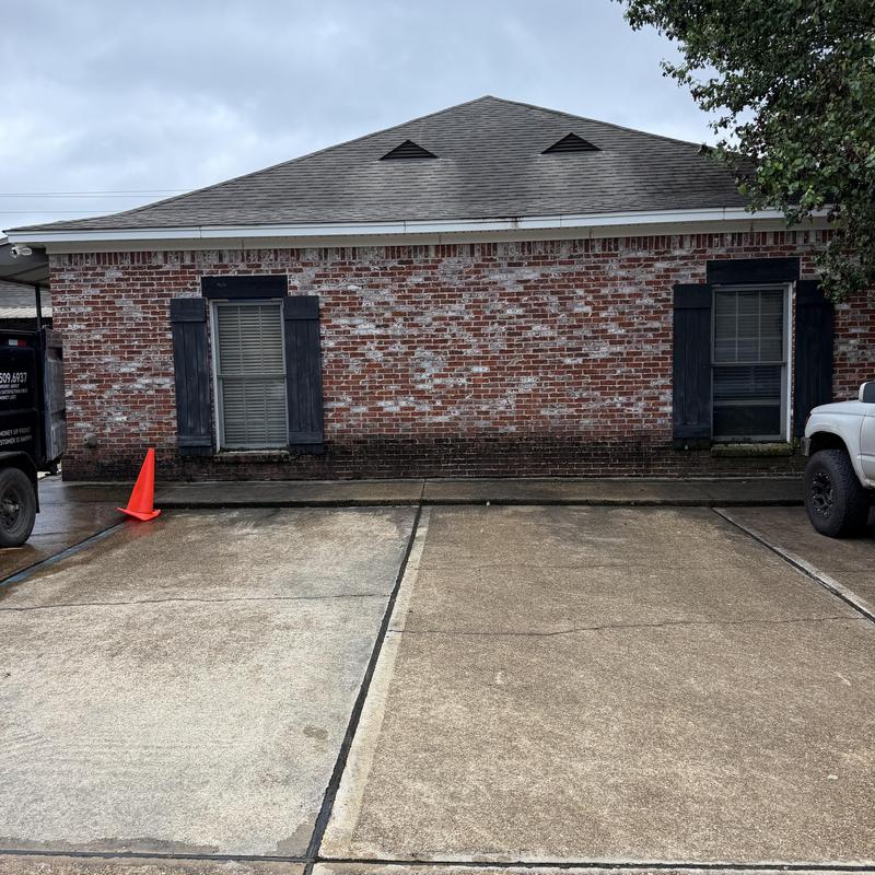 Roof shingles and brick exterior of commercial building