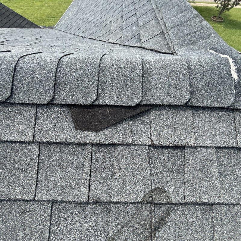 Asphalt shingles with hail damage and granule loss