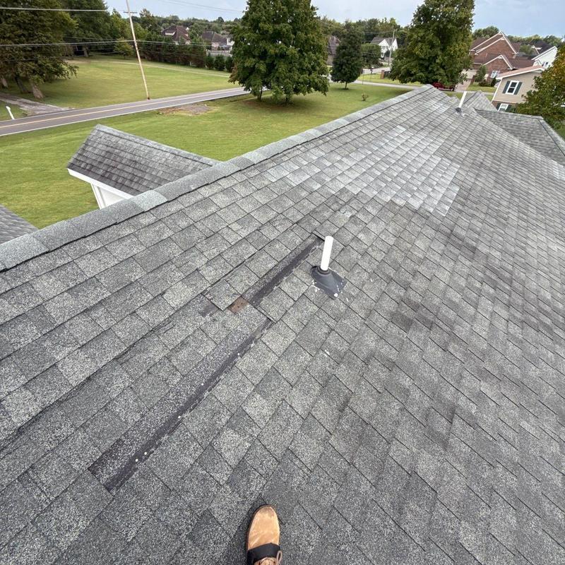 Roof shingles with hail damage and vent pipe flashing