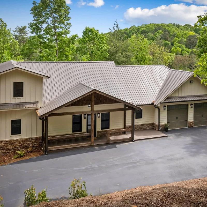 Metal roof installation on residential house with porch