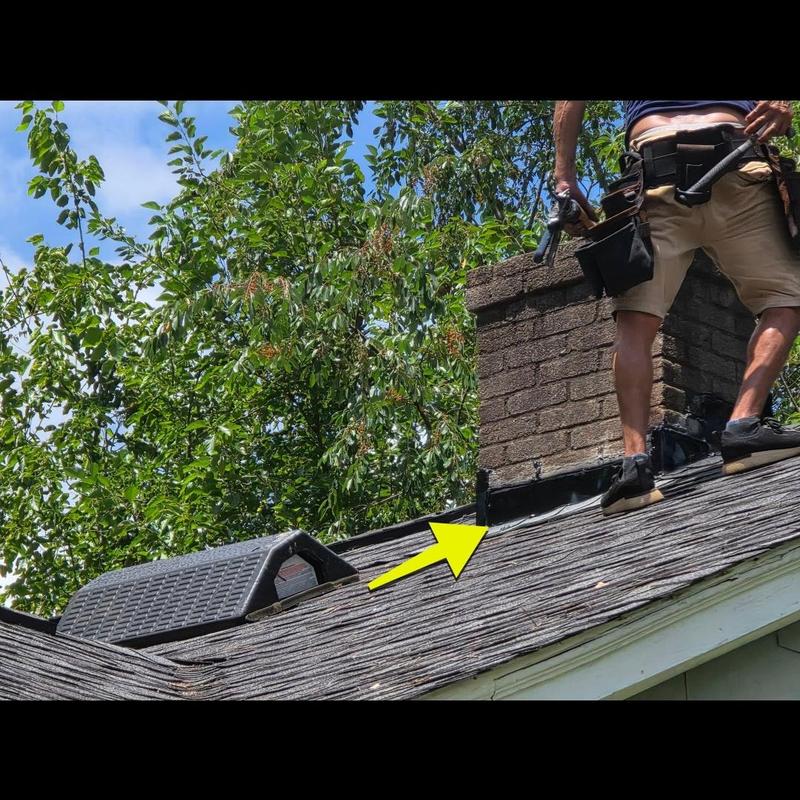 Chimney flashing sealing on roof with worker Chimney flashing sealing on roof with worker