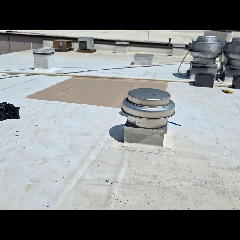 Commercial roof silicone coating around vents and seams Commercial roof silicone coating around vents and seams