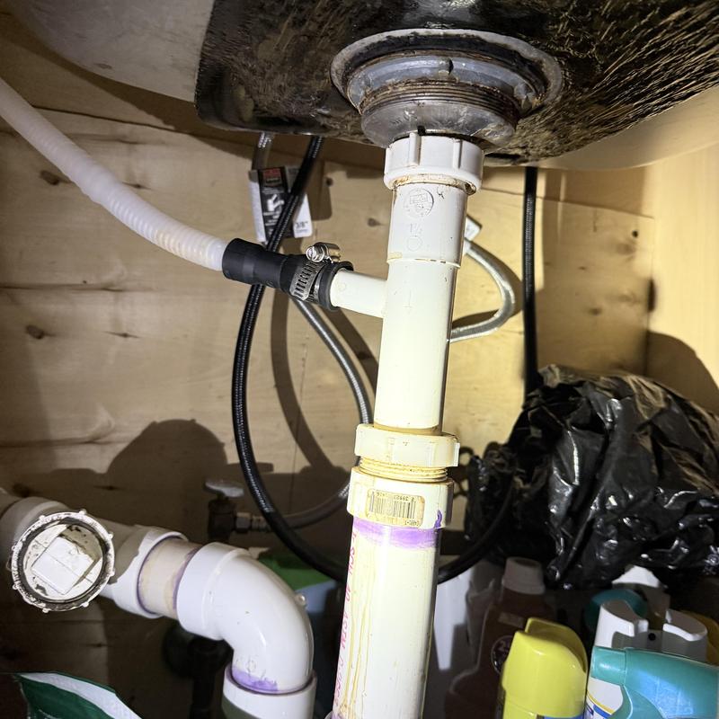 Kitchen sink drain pipe with clamp and fittings under sink Kitchen sink drain pipe with clamp and fittings under sink