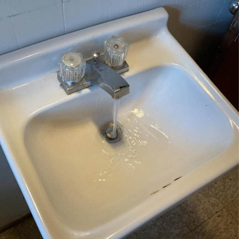 Bathroom sink faucet with running water Bathroom sink faucet with running water