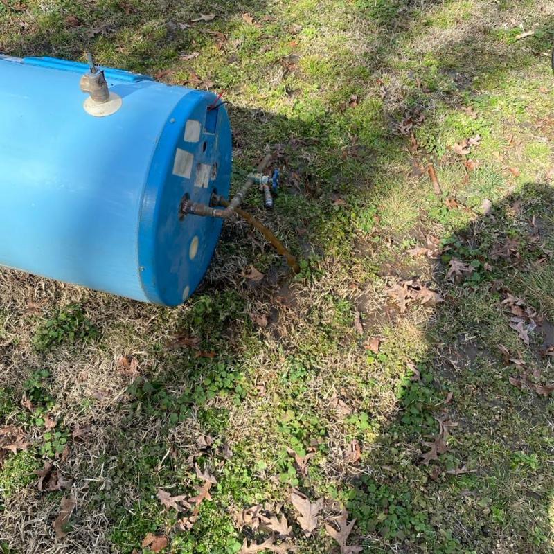 50 gallon electric water heater removed on grass 50 gallon electric water heater removed on grass