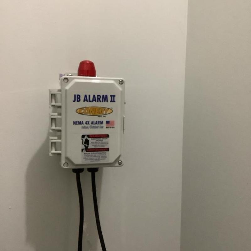 Sewage grinder backup float alarm installed on wall Sewage grinder backup float alarm installed on wall