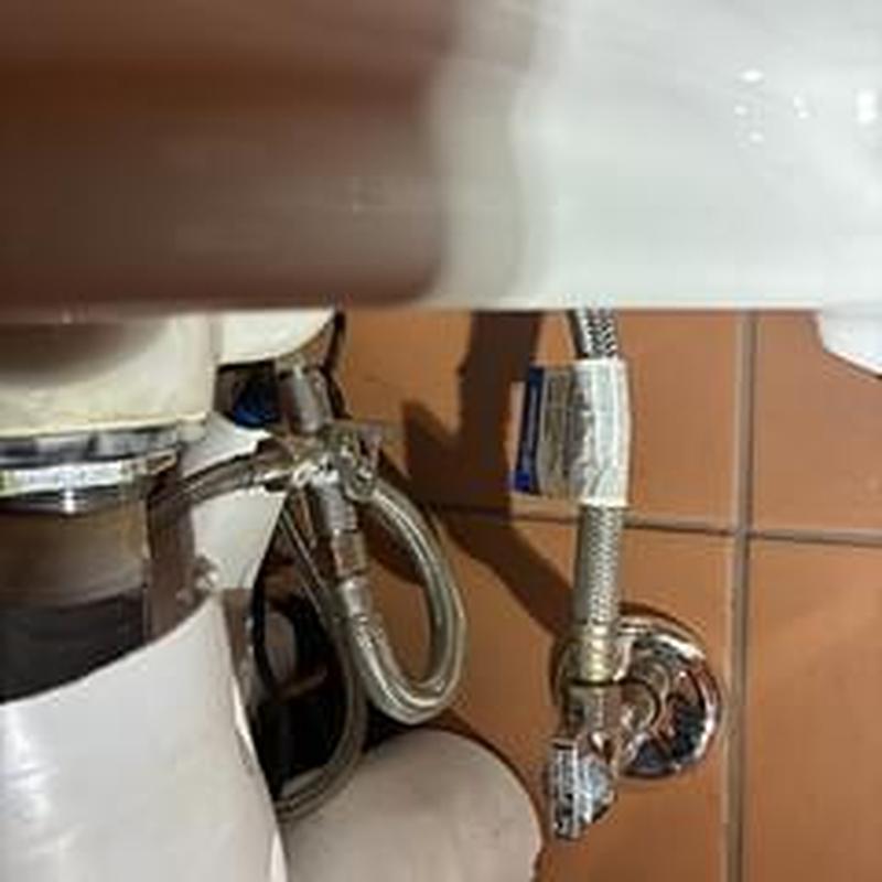 Mixing valve and water supply lines under sink