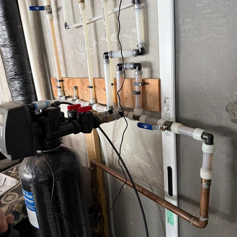 Water softener system with valve controls and piping