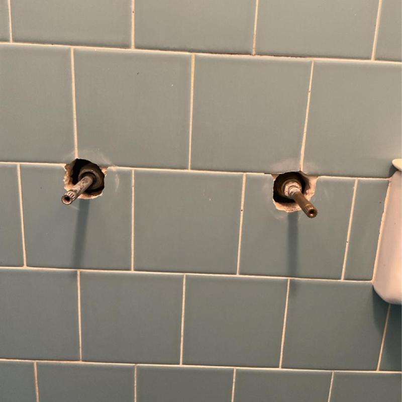 Two-handle shower faucet valve stems in tiled wall Two-handle shower faucet valve stems in tiled wall