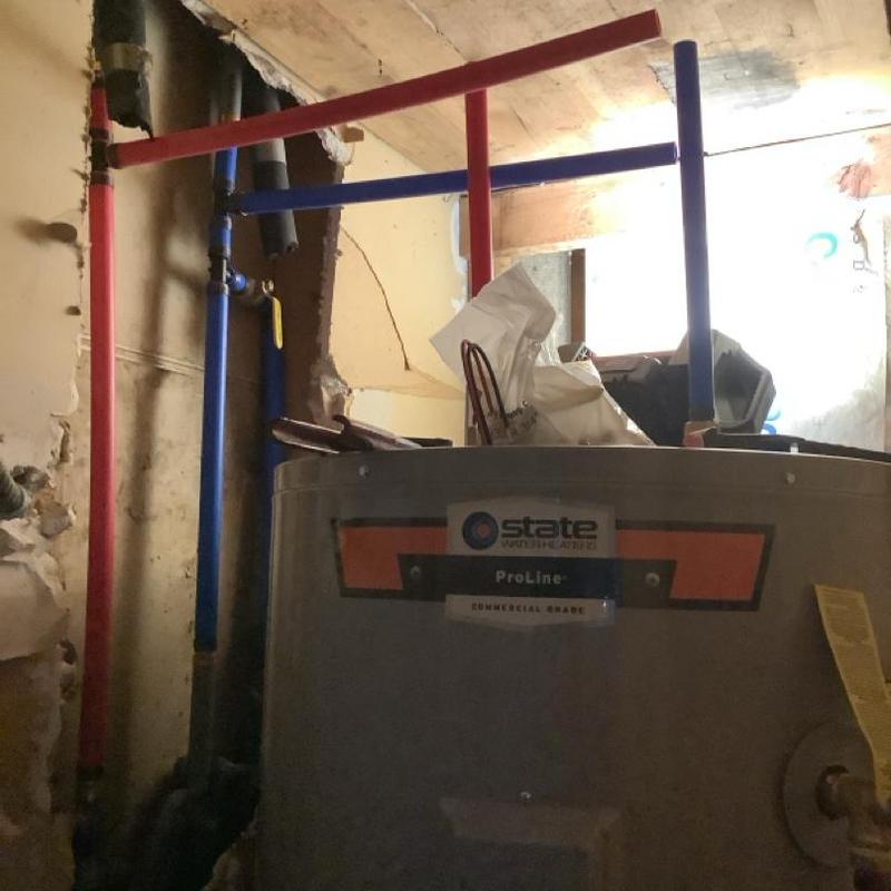 Electric water heater with new red and blue piping Electric water heater with new red and blue piping