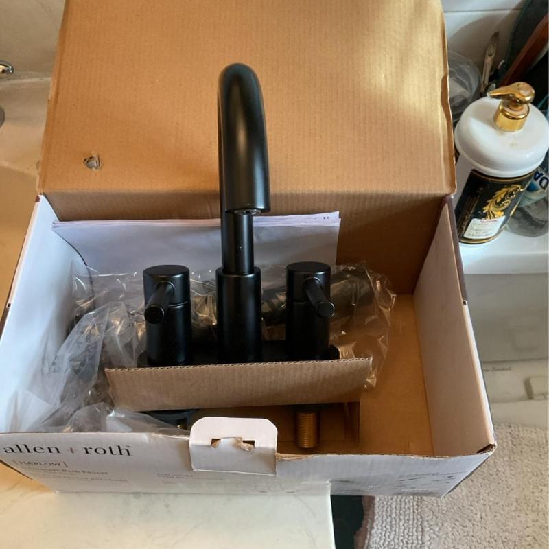 Bathroom sink faucet in packaging box Bathroom sink faucet in packaging box