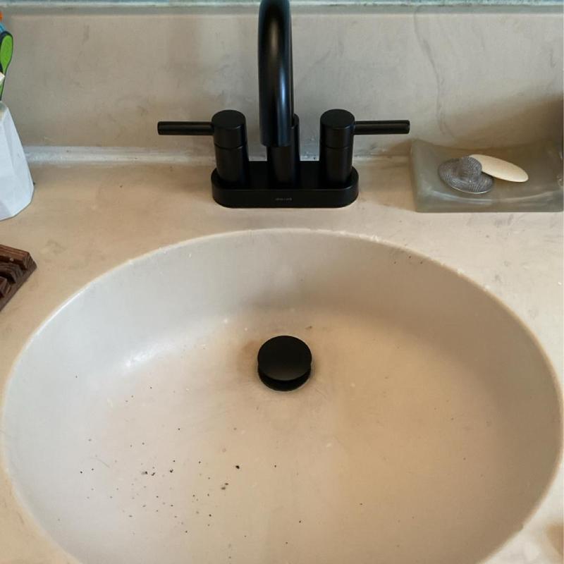 Bathroom sink faucet with matte black handles and drain Bathroom sink faucet with matte black handles and drain