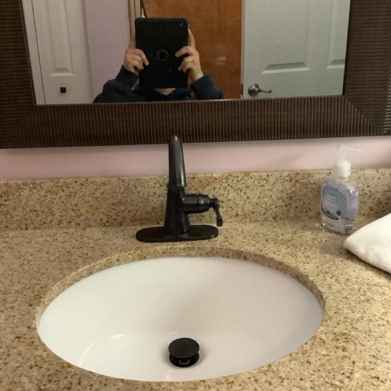 Single handle lavatory faucet on granite countertop Single handle lavatory faucet on granite countertop