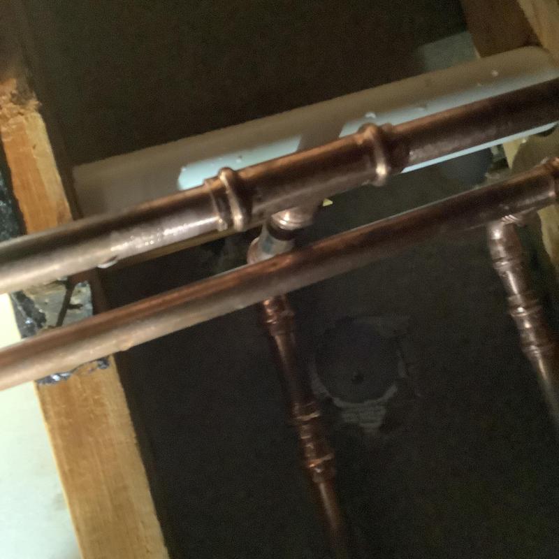 Copper water lines with T-joint fitting in wall cavity Copper water lines with T-joint fitting in wall cavity