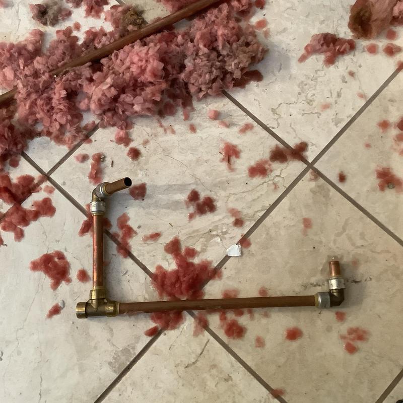 3/4-inch copper water line with fittings and debris 3/4-inch copper water line with fittings and debris