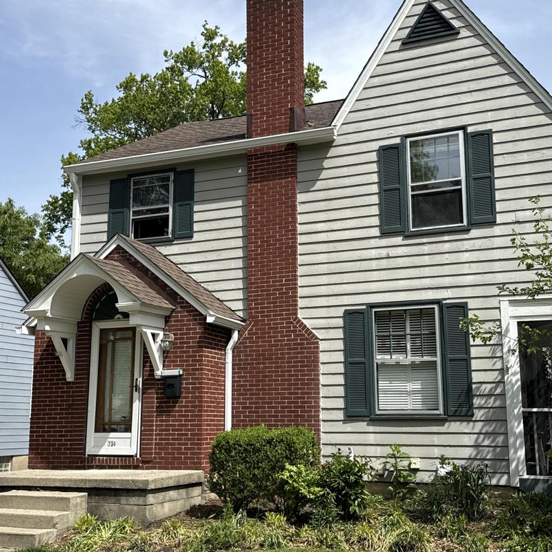 Gutters installed on brick and siding home exterior