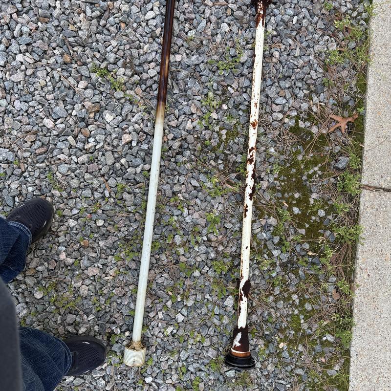 Water tank dip tubes removed on gravel surface Water tank dip tubes removed on gravel surface