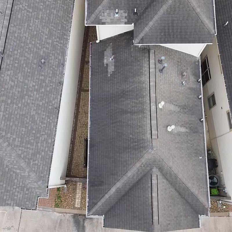 Asphalt shingle roof inspection on a three-story home