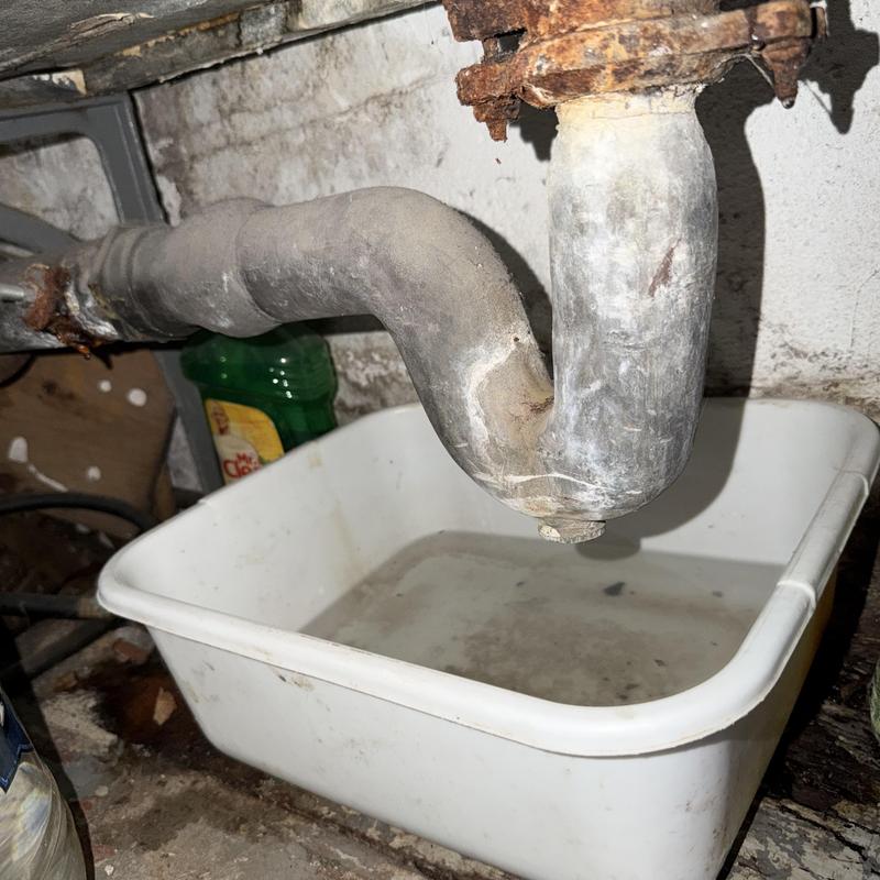 Bathroom tub drain pipe with rust and leak basin Bathroom tub drain pipe with rust and leak basin