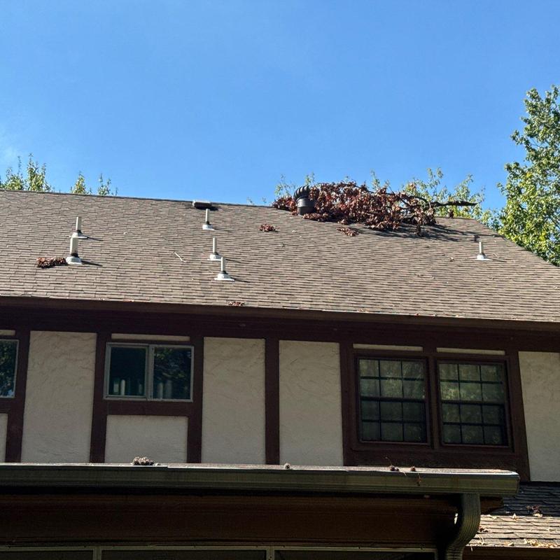 Owens Corning Oakridge asphalt roof with debris pile