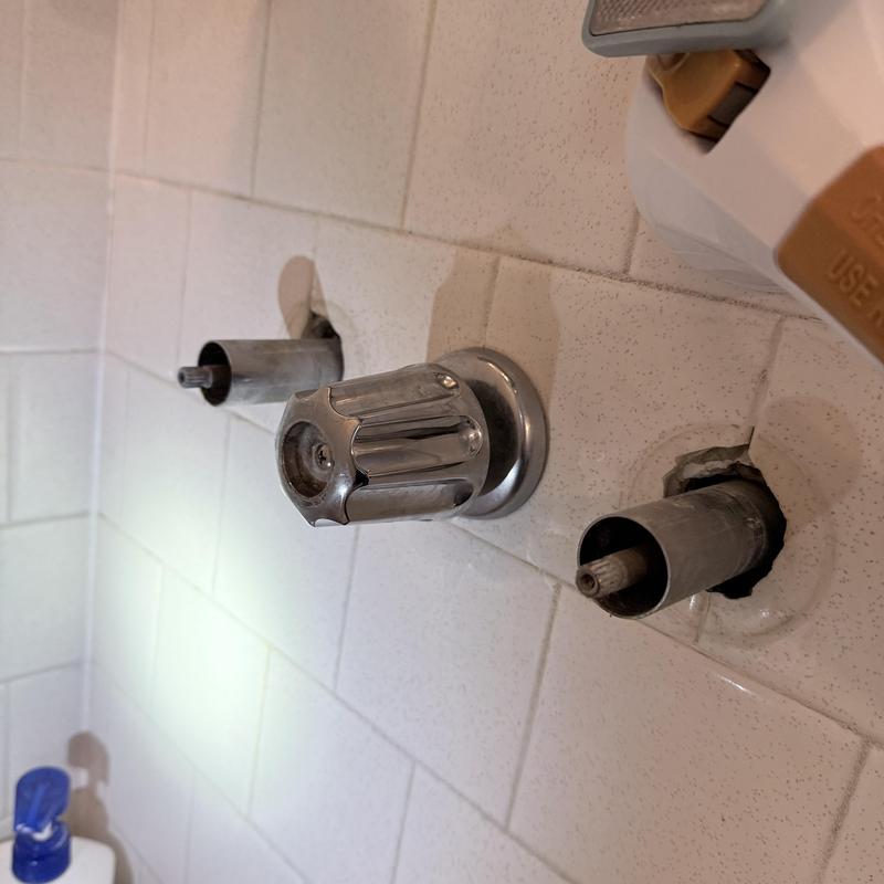 Three-handle shower valve with one handle replaced Three-handle shower valve with one handle replaced
