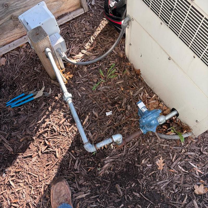 Galvanized pipe fittings on outside generator setup