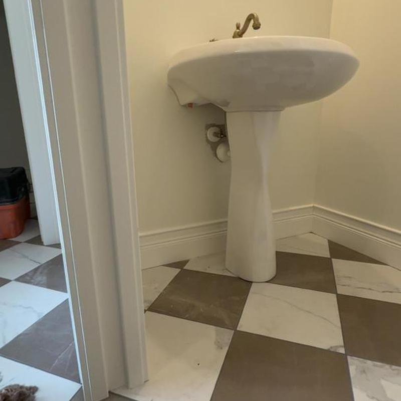 Pedestal sink installation in bathroom corner