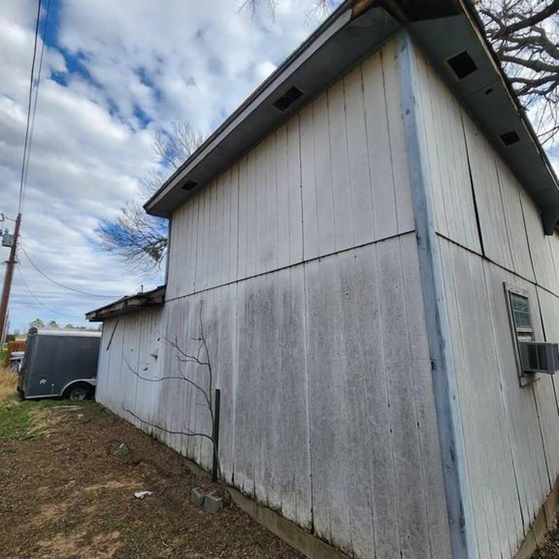 Shed exterior siding with weathered wood panels