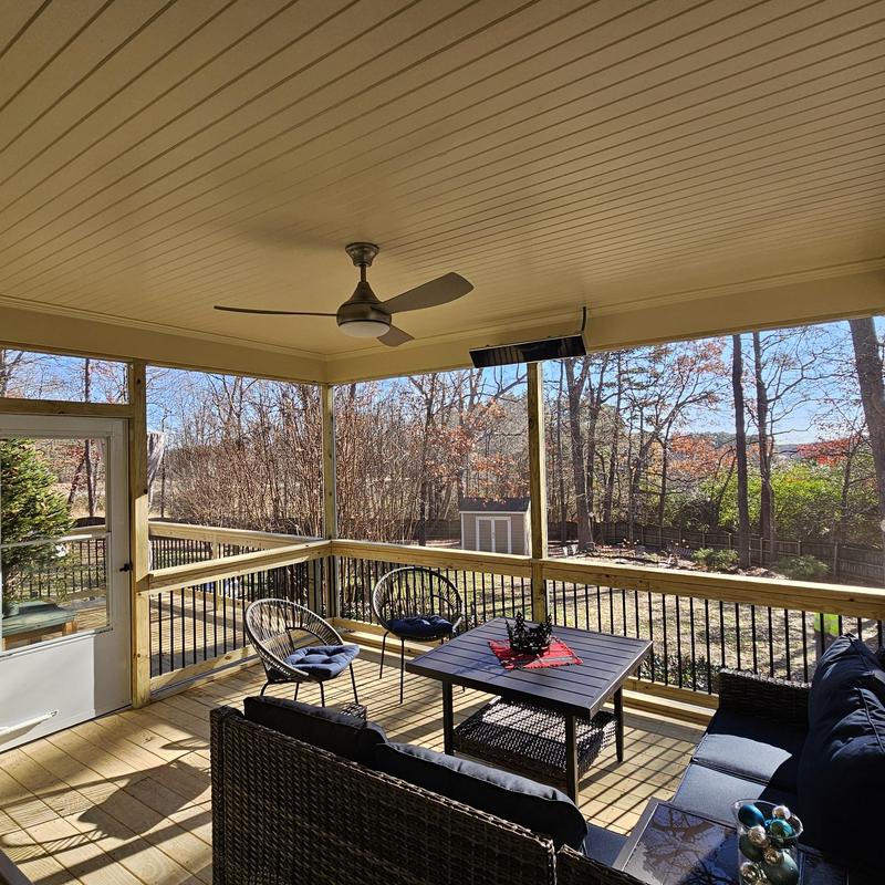 Deck ceiling with ceiling fan and outdoor seating area