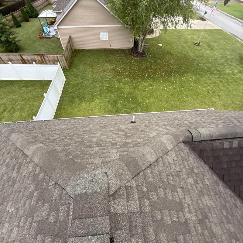 Asphalt shingle roof ridge and valley inspection