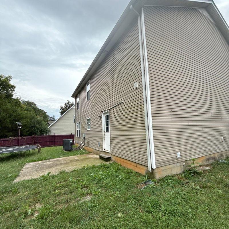 Vinyl siding exterior on residential house side wall