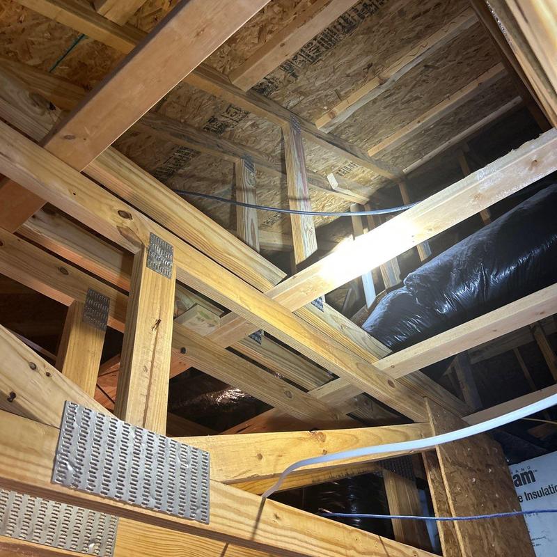 Roof truss framing with electrical wiring and insulation
