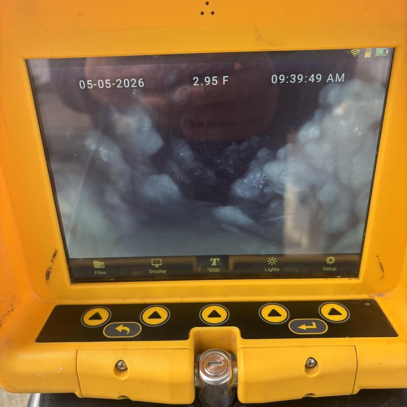 Drain line camera inspection on screen in yellow casing Drain line camera inspection on screen in yellow casing