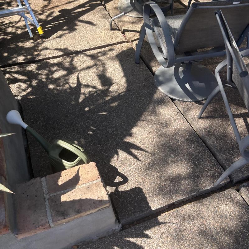 Drain line access and patio furniture in shade Drain line access and patio furniture in shade