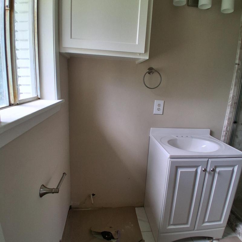 Toilet paper roll holder and towel ring installation in bathroom