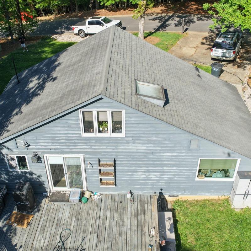 Roof skylight and asphalt shingle roof overview