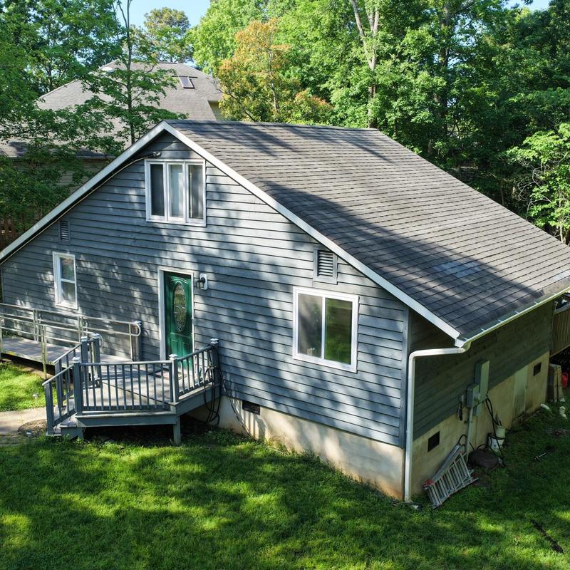 White gutters and metal fascia on house exterior