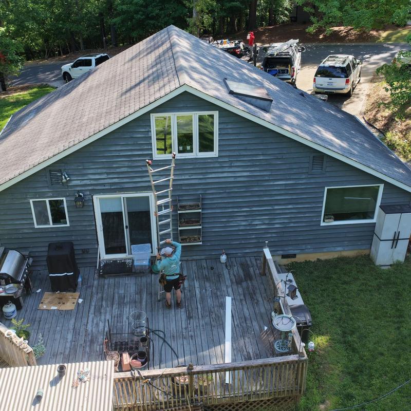 Gutter removal and fascia board replacement on house