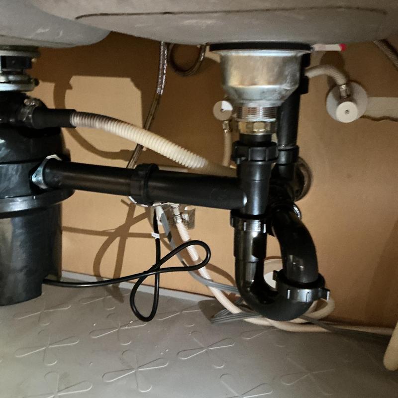 Kitchen sink drain pipes and trap under cabinet Kitchen sink drain pipes and trap under cabinet