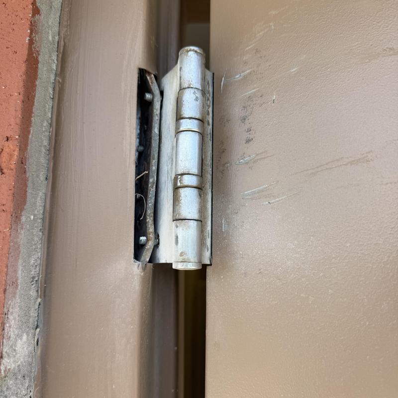 Continuous hinge kit on damaged park restroom door Continuous hinge kit on damaged park restroom door