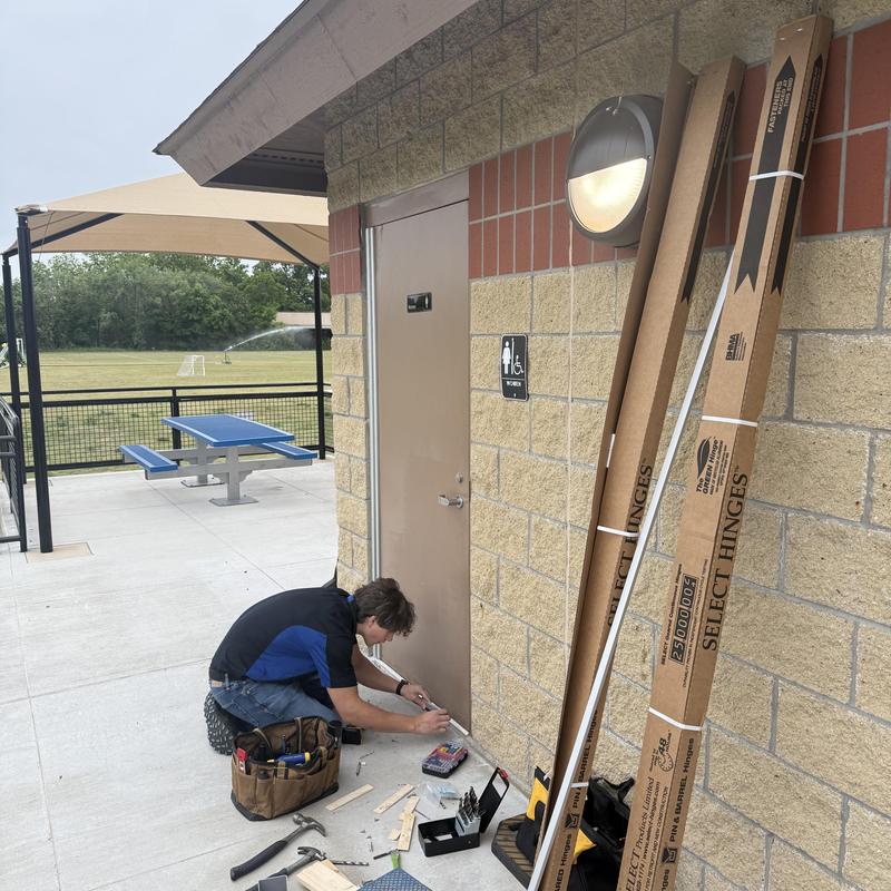 Continuous hinge kits install on park restroom doors Continuous hinge kits install on park restroom doors