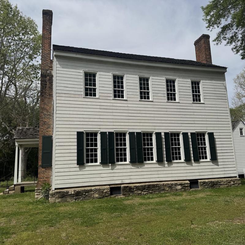 Cedar shake roof porch with historic wood siding